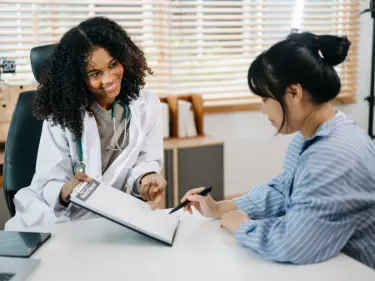 female doctor talking to patient