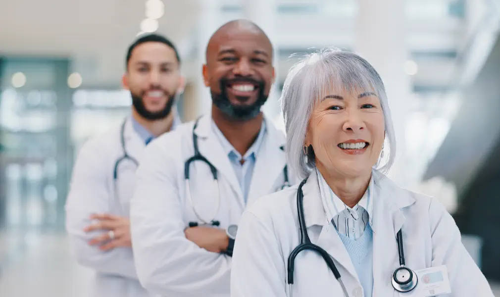 three doctors smiing
