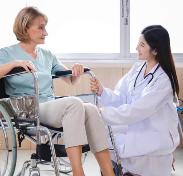 female doctor and elderly woman patient