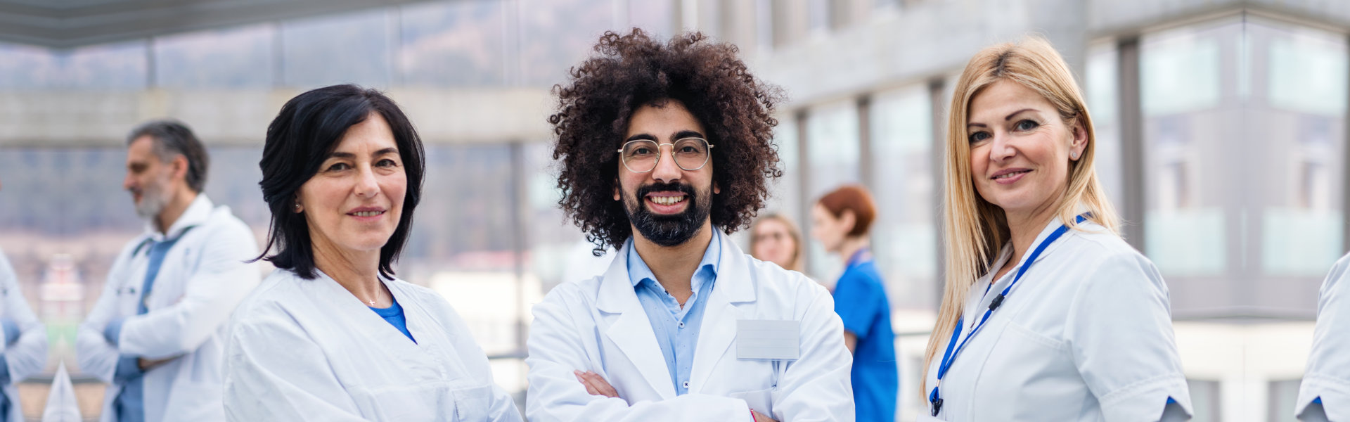 three doctors smiling
