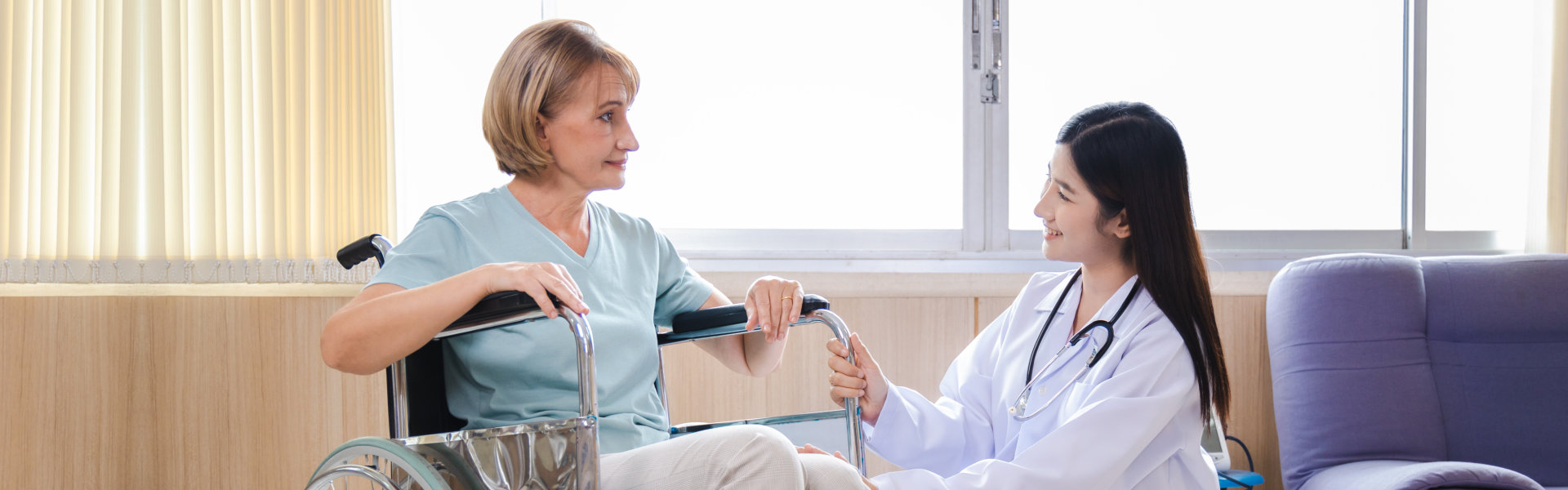 female doctor and elderly woman patient