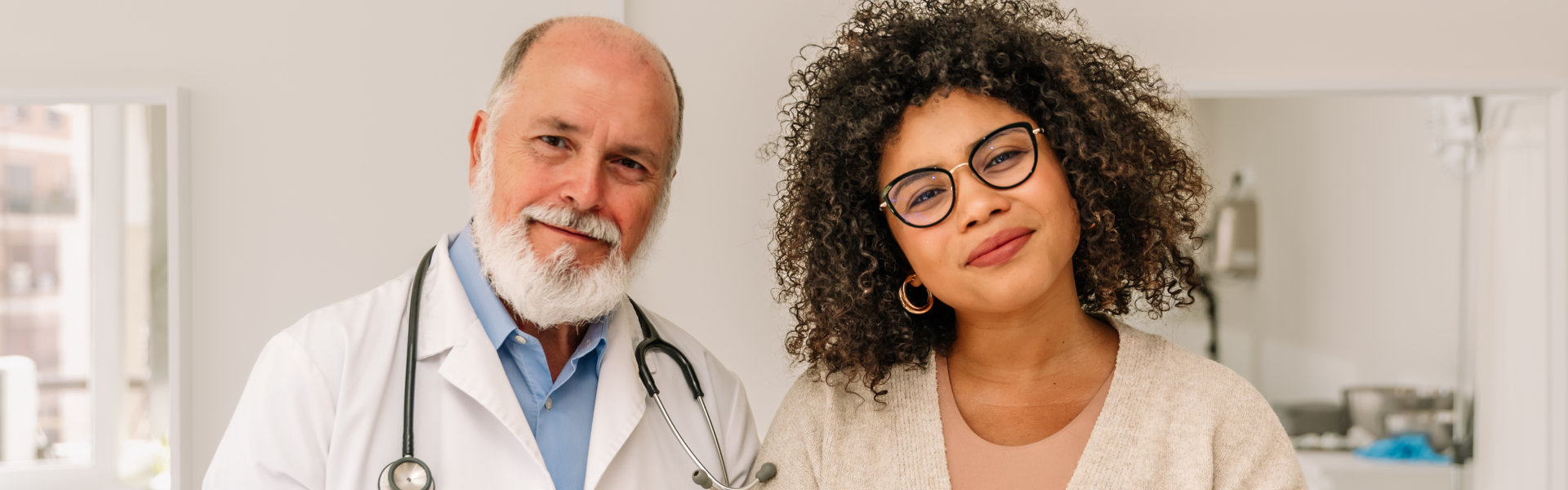 a doctor and his patient smiling