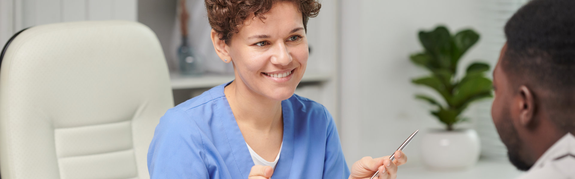 female medical specialist sitting at table